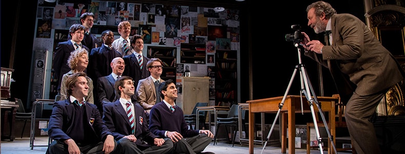 Photo of The History Boys cast in costume performing onstage