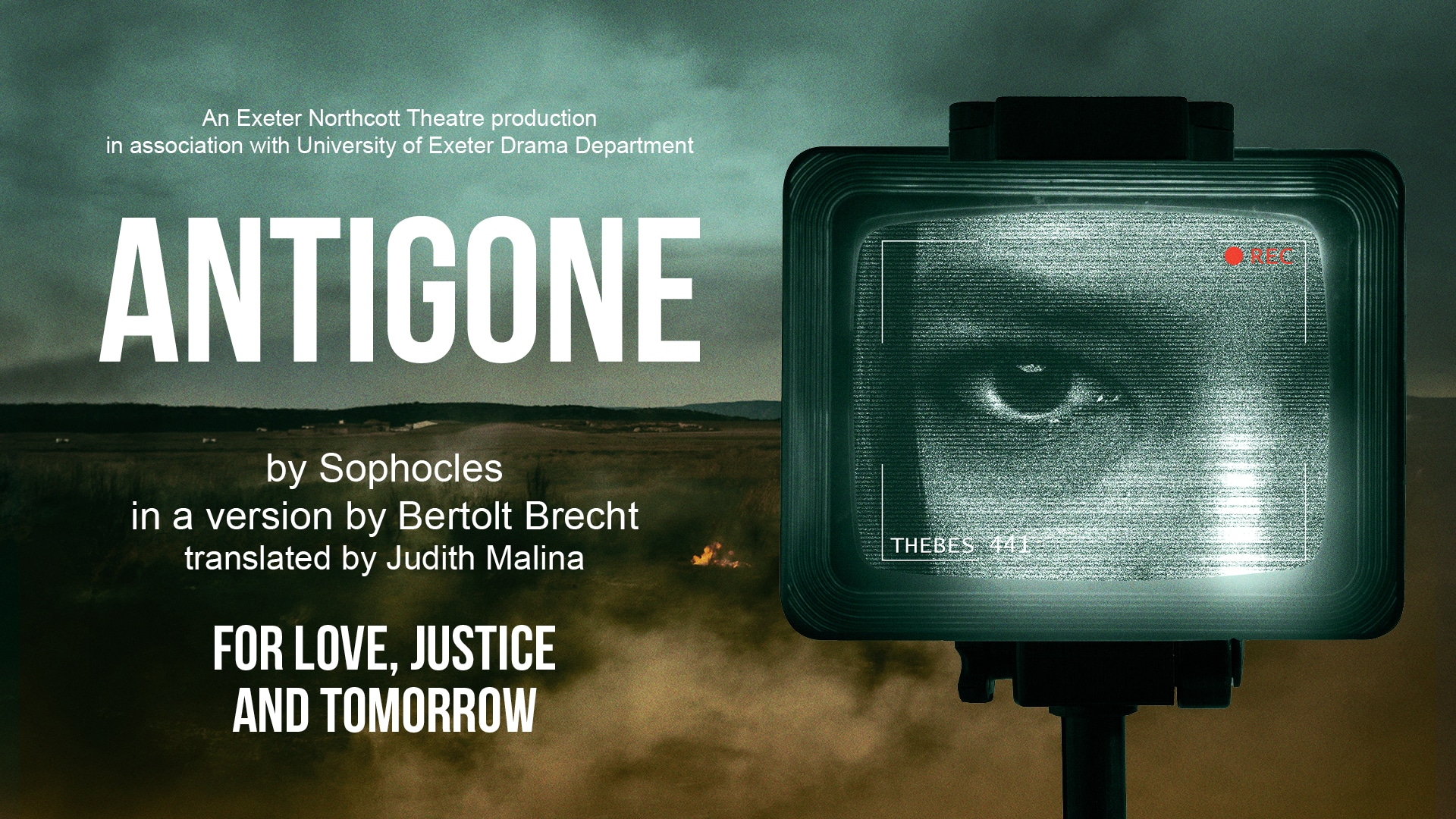 Antigone promotional image - a young woman on a security camera looking in closely and intensely