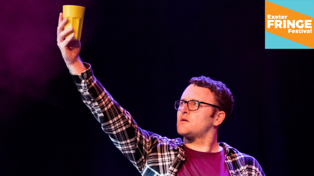 Promotional image for Futures Scratch Night - a young man on stage, holding high a yellow cup