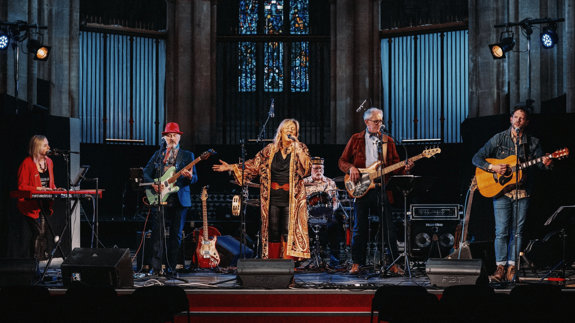 The Julie July band performing on stage